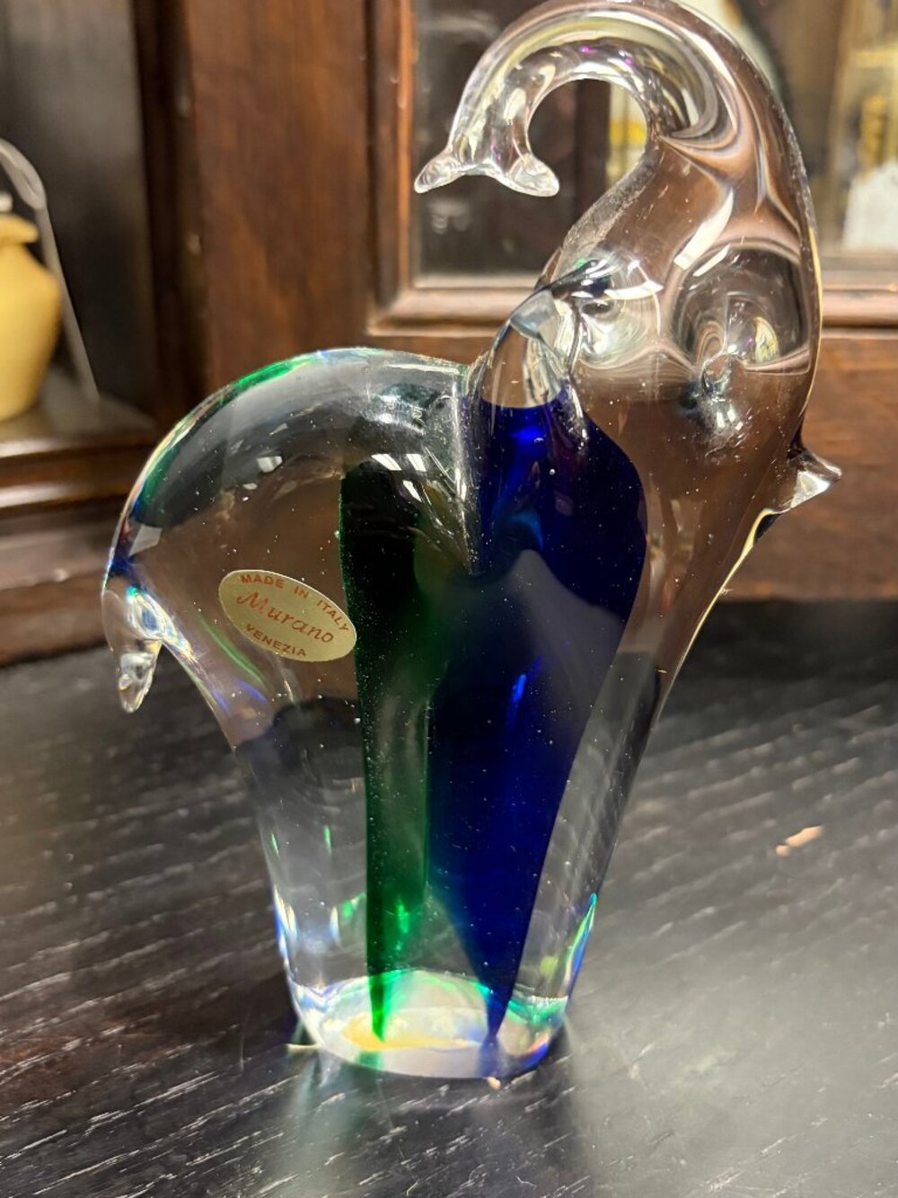 Murano hand-blown art glass fish sculpture with rich green and amber color suspe